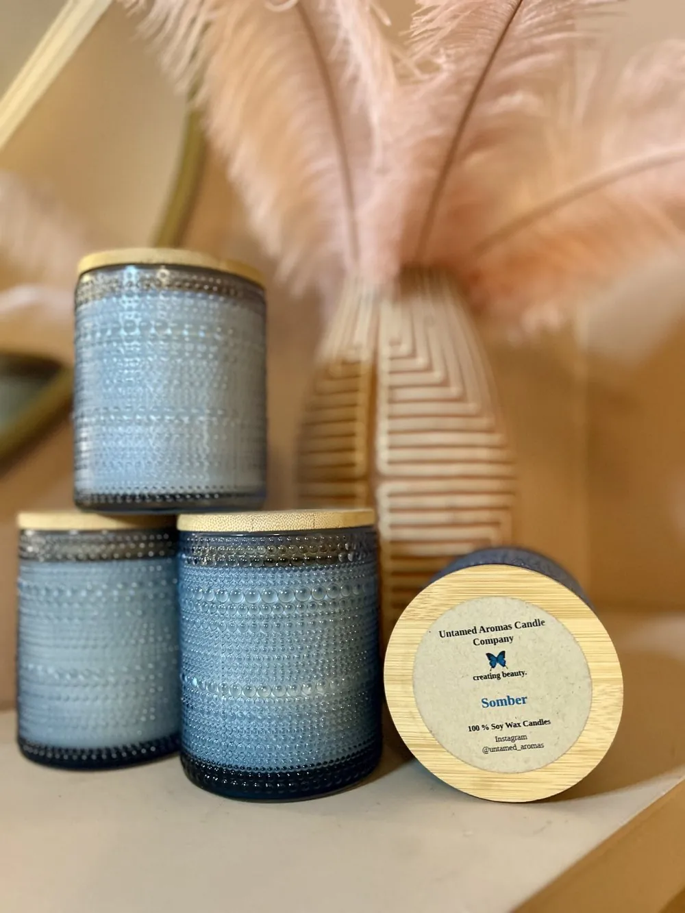Untamed Aromas candles in sky-blue bubble glass